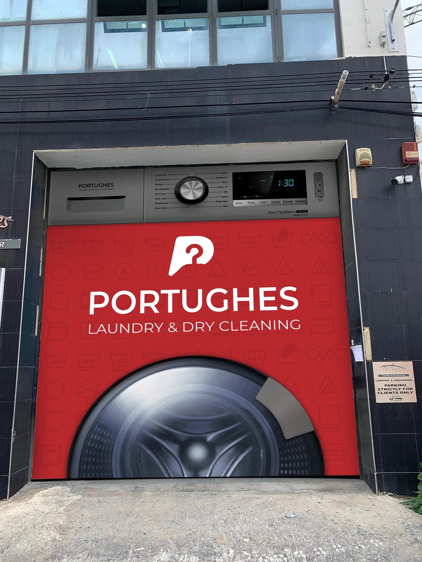 Portughes facade design showing the white logo on red above a washing-machine image.
